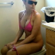 A girl wearing sunglasses takes a noisy, wet, explosive shit while sitting on a toilet. We later get to see her wiping herself. Nice sounds! Over 4 minutes.